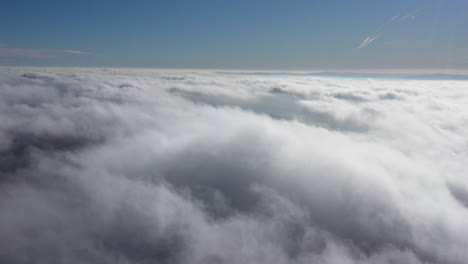 Above-clouds-fluffy-aerial-shot-France-sunny-day
